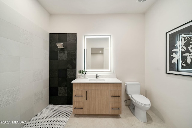 bathroom with tile patterned floors, vanity, and toilet