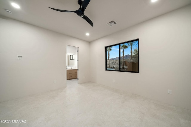 unfurnished room with ceiling fan