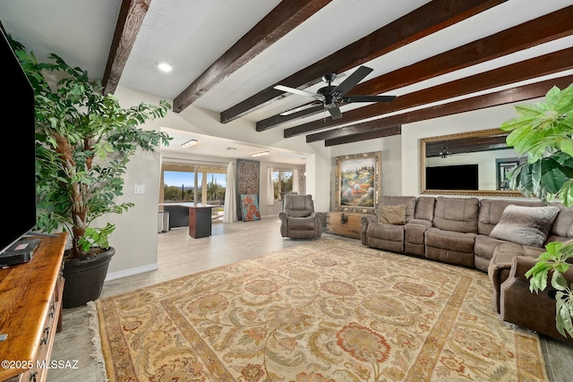 living room featuring beam ceiling and ceiling fan