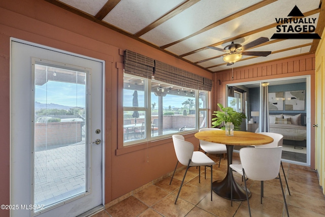 sunroom featuring ceiling fan