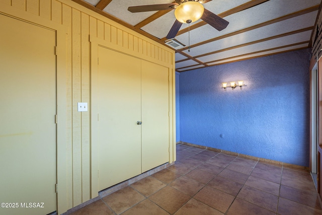 unfurnished bedroom with a closet and ceiling fan