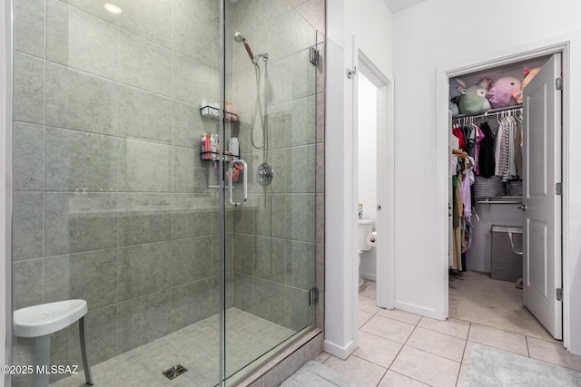 bathroom featuring tile patterned flooring and walk in shower