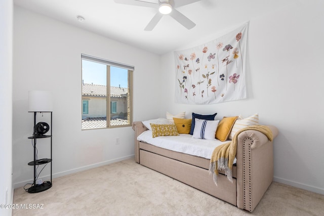 bedroom featuring light carpet and ceiling fan