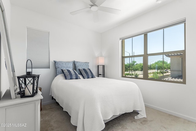 carpeted bedroom with ceiling fan