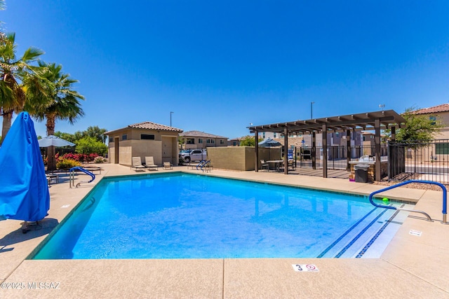 view of pool with a pergola and a patio