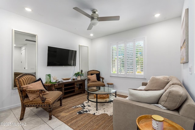 tiled living room with ceiling fan