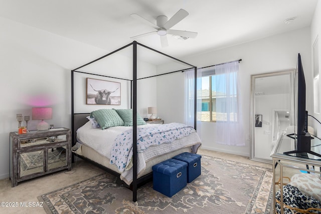 bedroom featuring ceiling fan and carpet