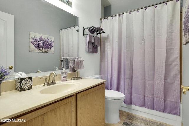 full bathroom with toilet and vanity