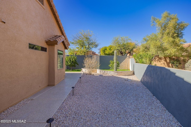 view of yard featuring a patio area and fence