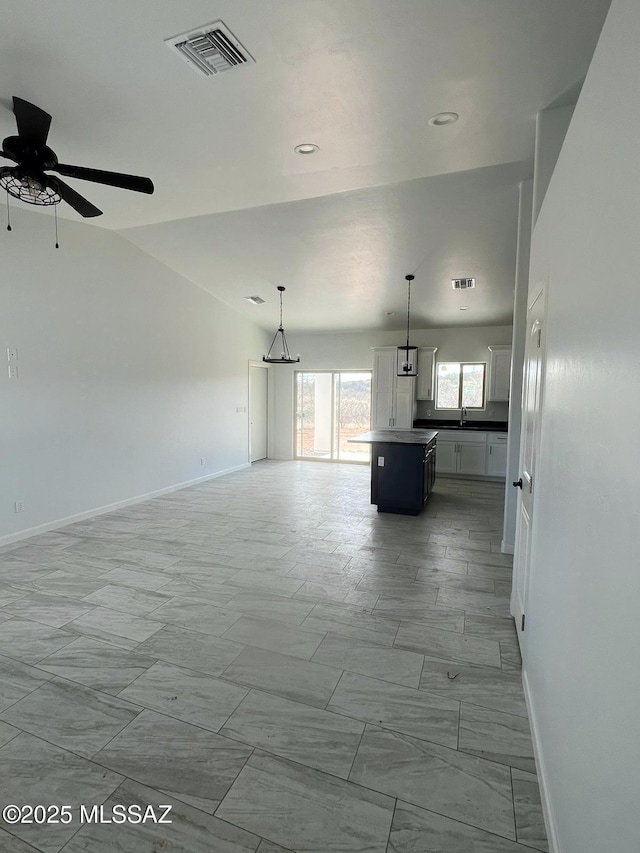 interior space with sink and ceiling fan