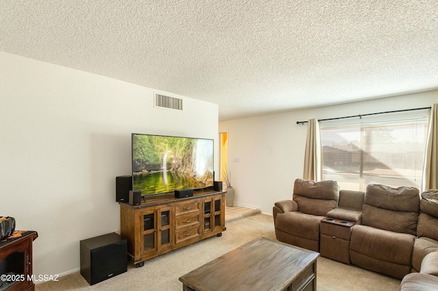 living room with light carpet and a textured ceiling