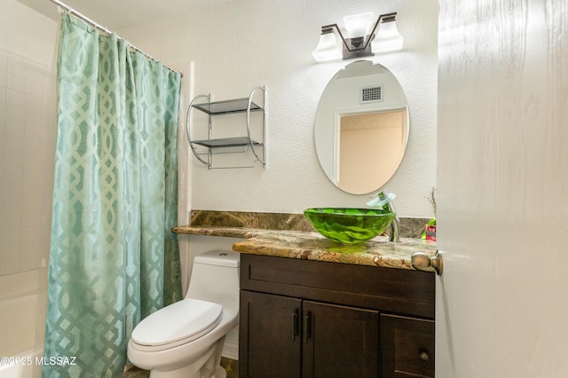 full bathroom with vanity, toilet, and shower / bath combo with shower curtain