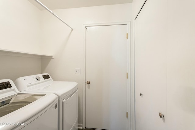 washroom with washer and dryer