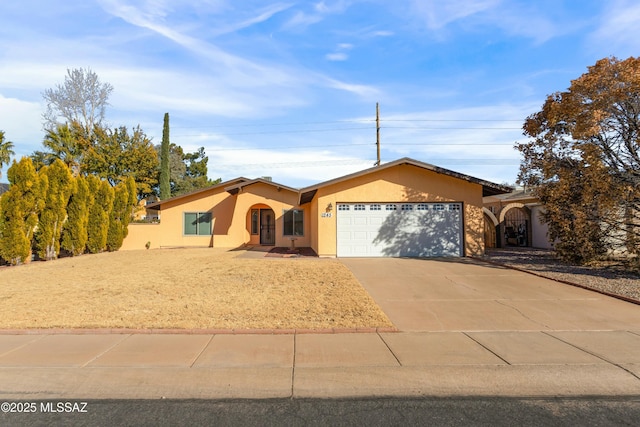 single story home featuring a garage