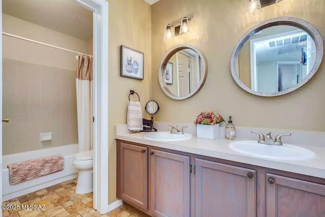 full bathroom with vanity, toilet, and shower / bath combo with shower curtain