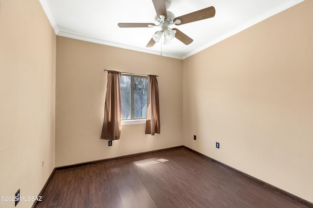 empty room with dark hardwood / wood-style flooring, crown molding, and ceiling fan