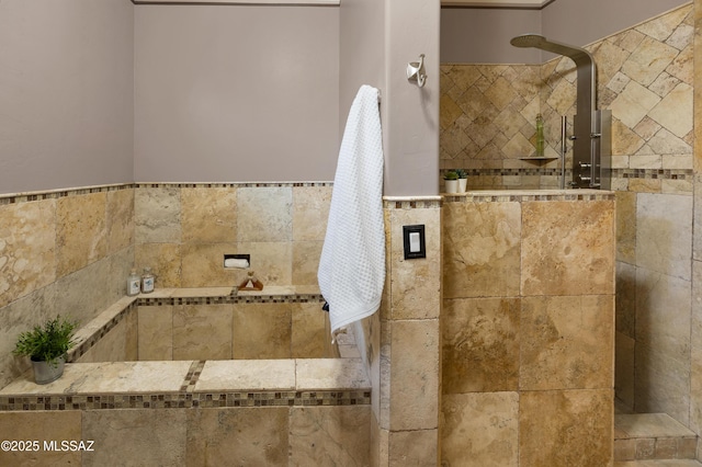 bathroom with a tile shower