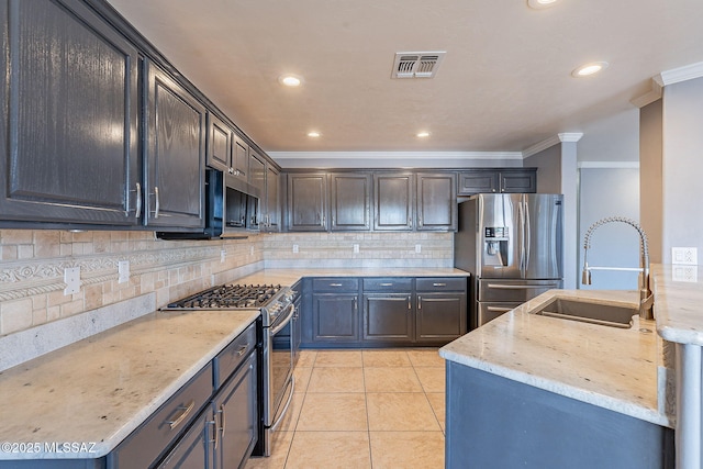 kitchen featuring sink, light stone counters, light tile patterned floors, ornamental molding, and appliances with stainless steel finishes