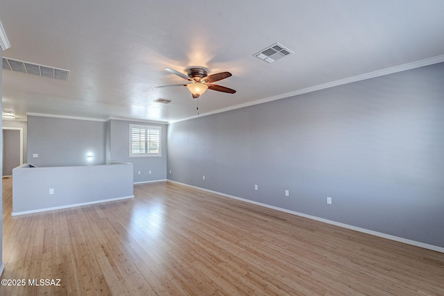 empty room featuring crown molding, ceiling fan, and light hardwood / wood-style floors