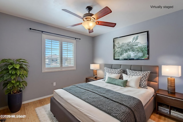 bedroom featuring ceiling fan and light hardwood / wood-style floors