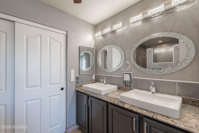 bathroom featuring vanity and decorative backsplash