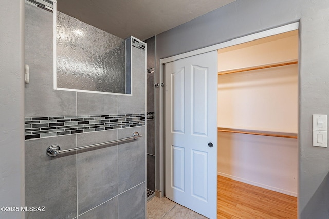 bathroom with hardwood / wood-style flooring