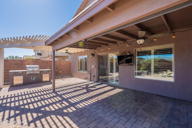 view of patio with area for grilling, a grill, a pergola, and ceiling fan