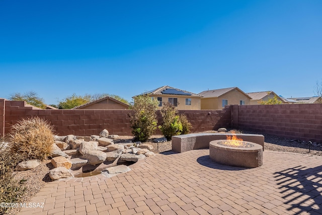 view of patio featuring an outdoor fire pit