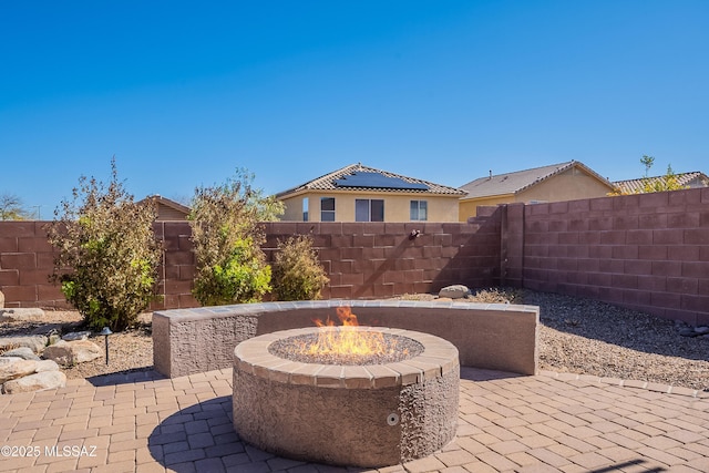 view of patio / terrace featuring a fire pit