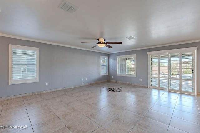 empty room featuring light tile patterned floors, ornamental molding, and ceiling fan