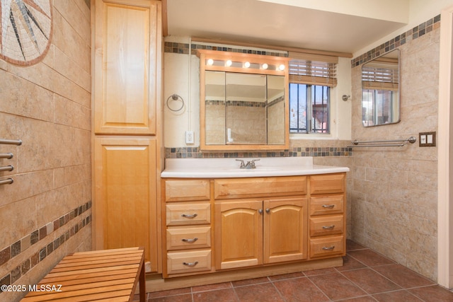 bathroom featuring vanity, tile walls, and tile patterned floors