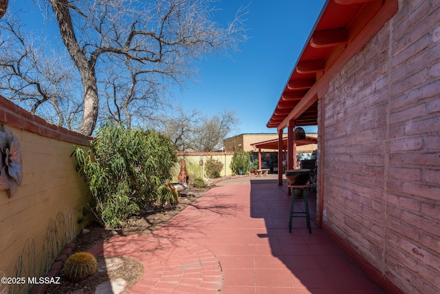 view of patio with fence