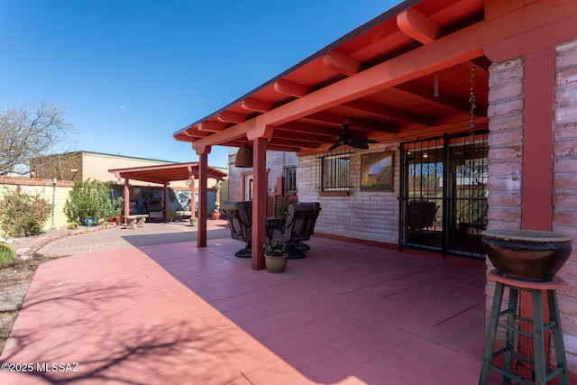 view of patio / terrace featuring fence and a gazebo