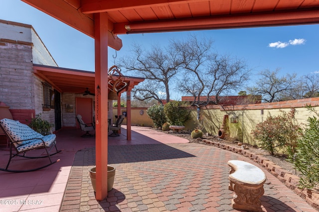 view of patio / terrace with a fenced backyard and a ceiling fan