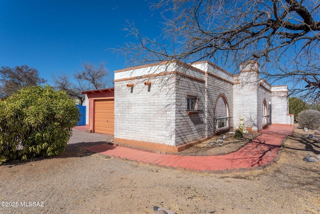 view of outbuilding featuring an attached garage