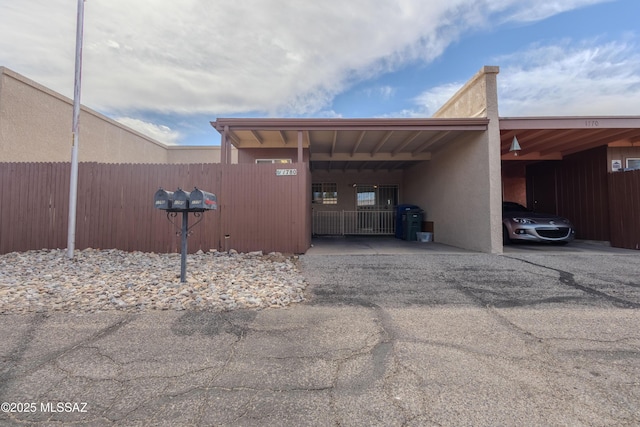 view of vehicle parking with a carport