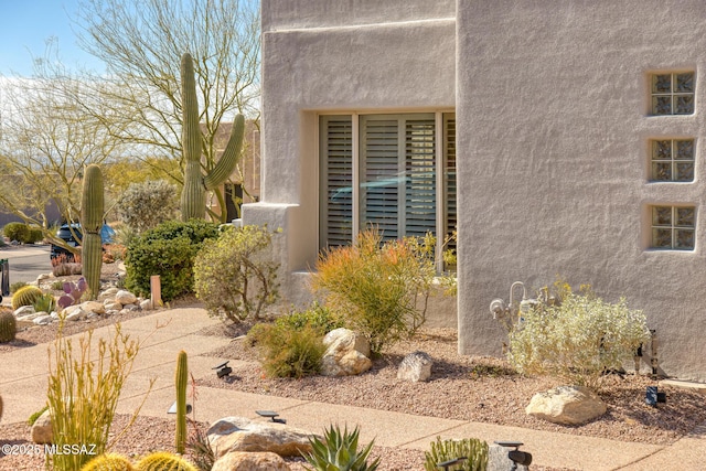 exterior space with stucco siding