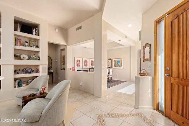 foyer with recessed lighting, baseboards, visible vents, and light tile patterned flooring