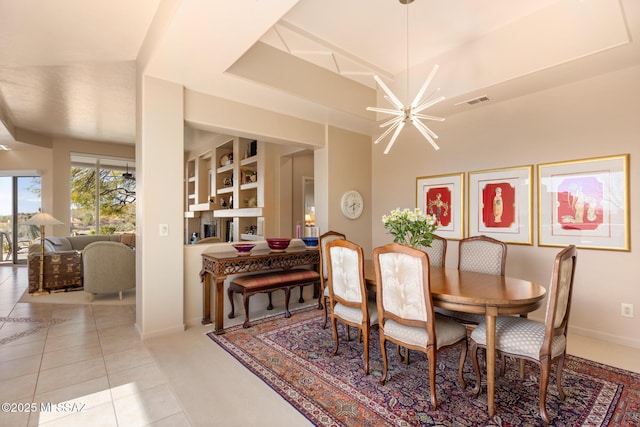 dining room with light tile patterned floors, a chandelier, visible vents, and baseboards