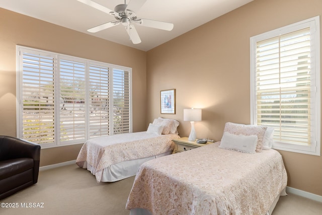 bedroom with carpet floors, ceiling fan, and baseboards