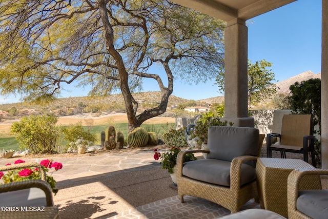 view of patio with a mountain view