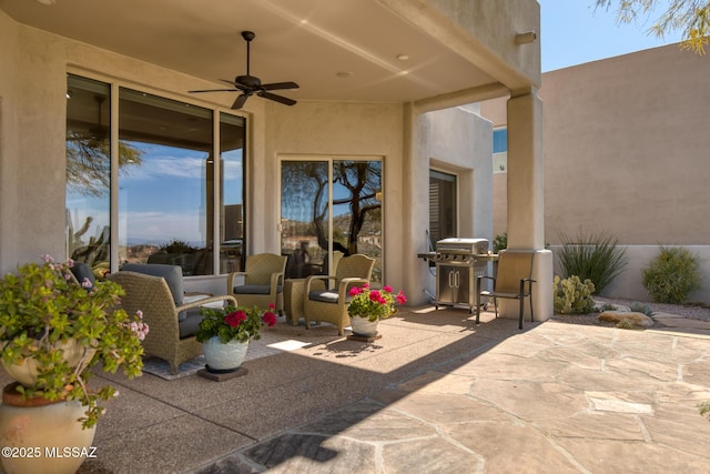 view of patio with grilling area and a ceiling fan