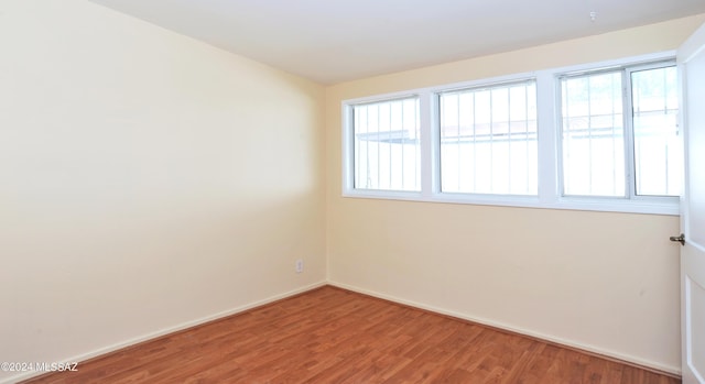 spare room featuring hardwood / wood-style floors