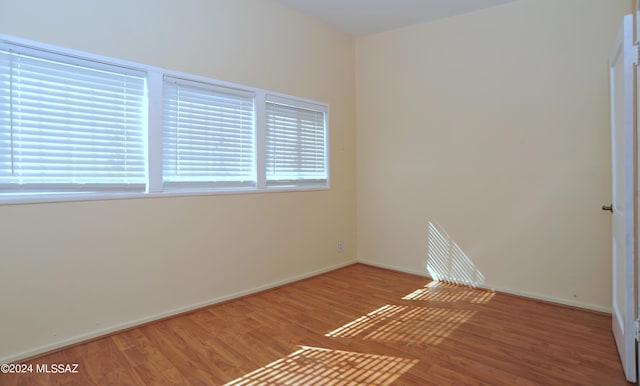 spare room featuring hardwood / wood-style floors