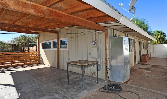 view of patio with an outbuilding