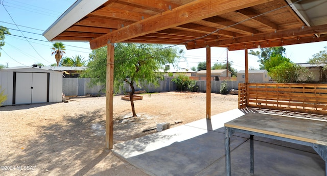 view of patio featuring a shed