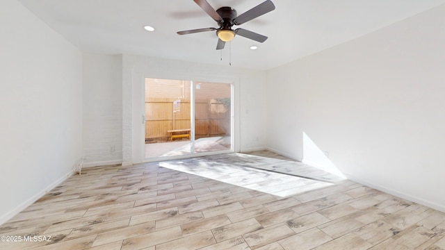 unfurnished room featuring ceiling fan and light hardwood / wood-style flooring