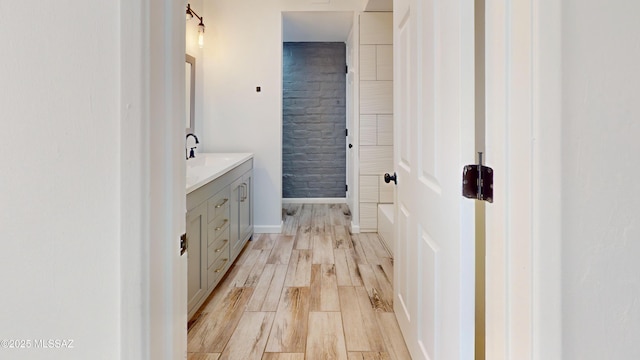 bathroom featuring vanity and hardwood / wood-style floors