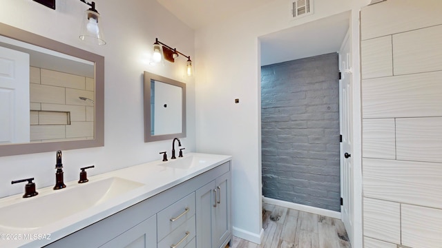 bathroom with vanity and hardwood / wood-style floors