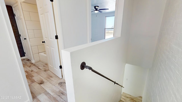 staircase with ceiling fan